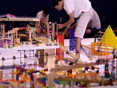 A giant chain reaction machine built by many teams