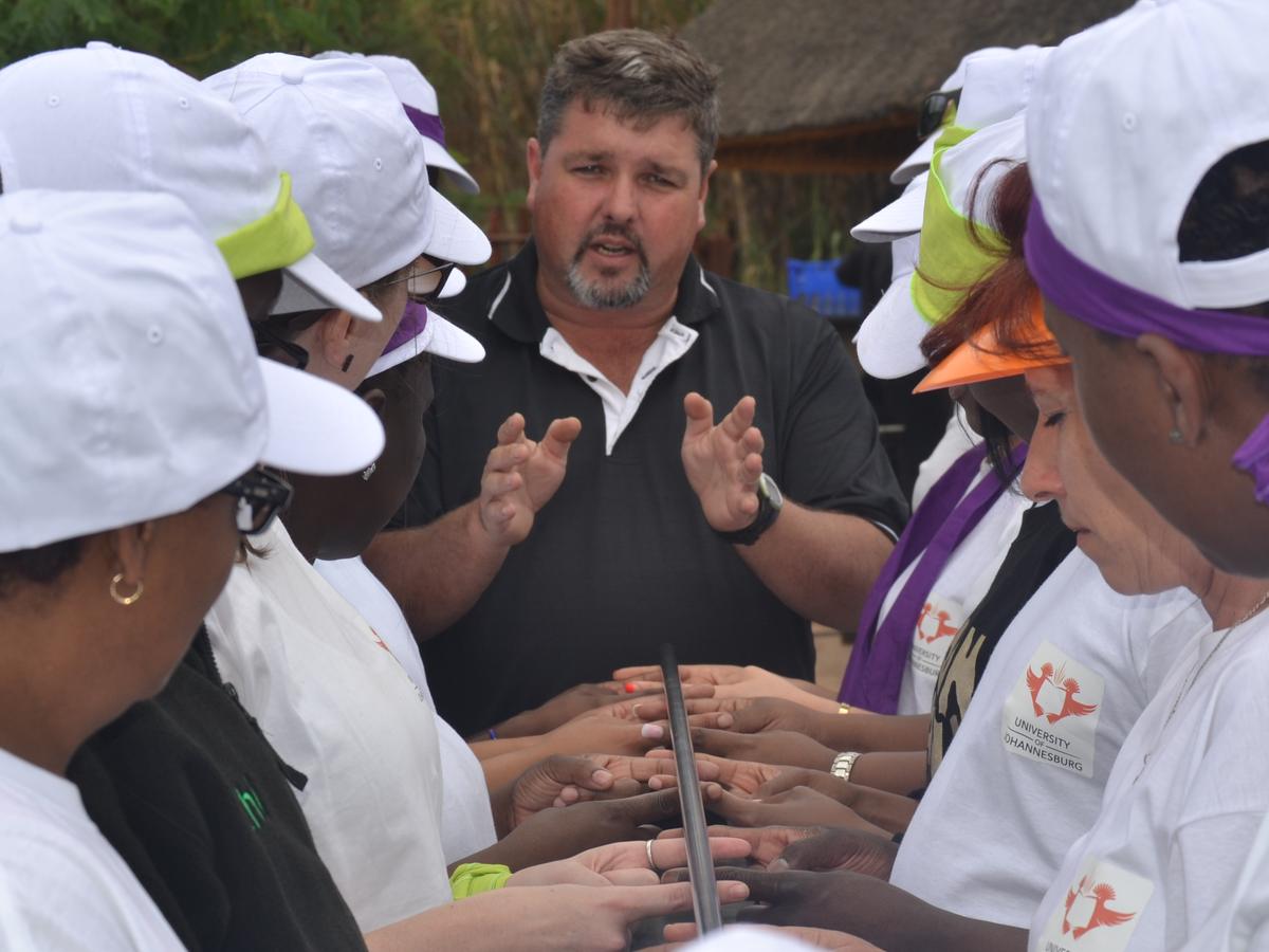 Mark Maguire facilitating a team challenge